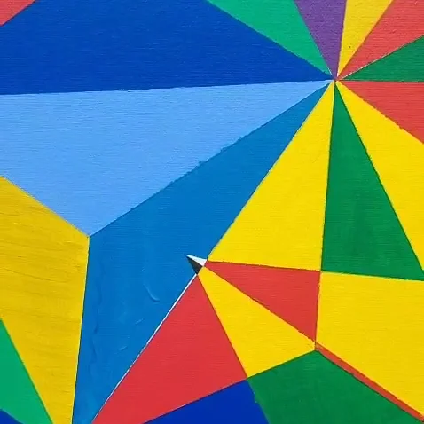 Close detail: a fan of cobalt and pale blue triangles opening into yellow and green.